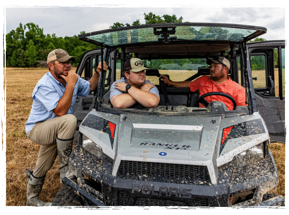 3 men talking at ATV